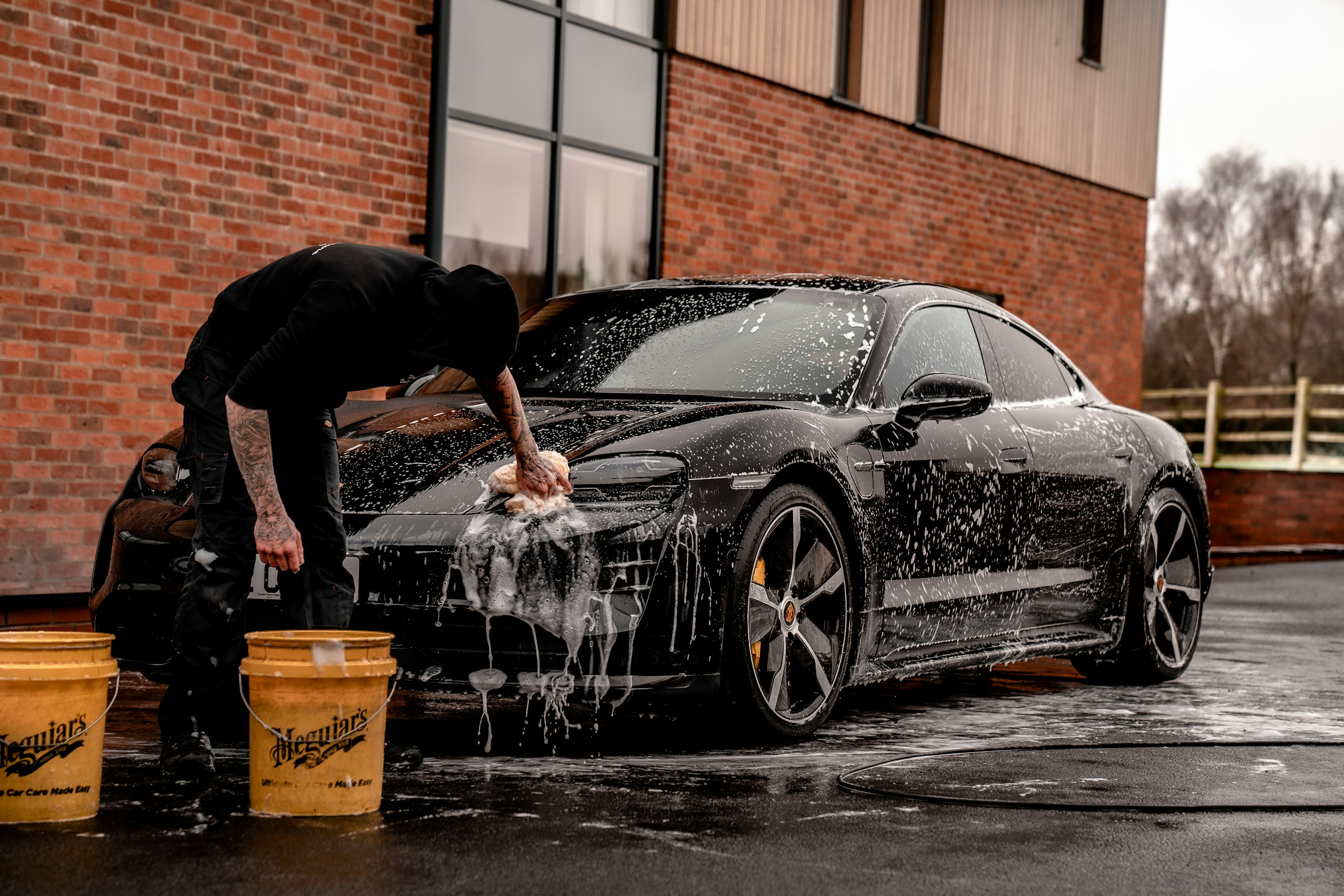 A finished vehicle in a controlled detailing environment